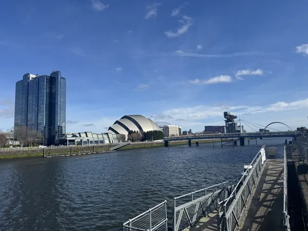 The River Clyde at Finnieston in Glasgow, looking towards the SEC Armadillo, the Finnieston Crane and the Clyde Arc bridge